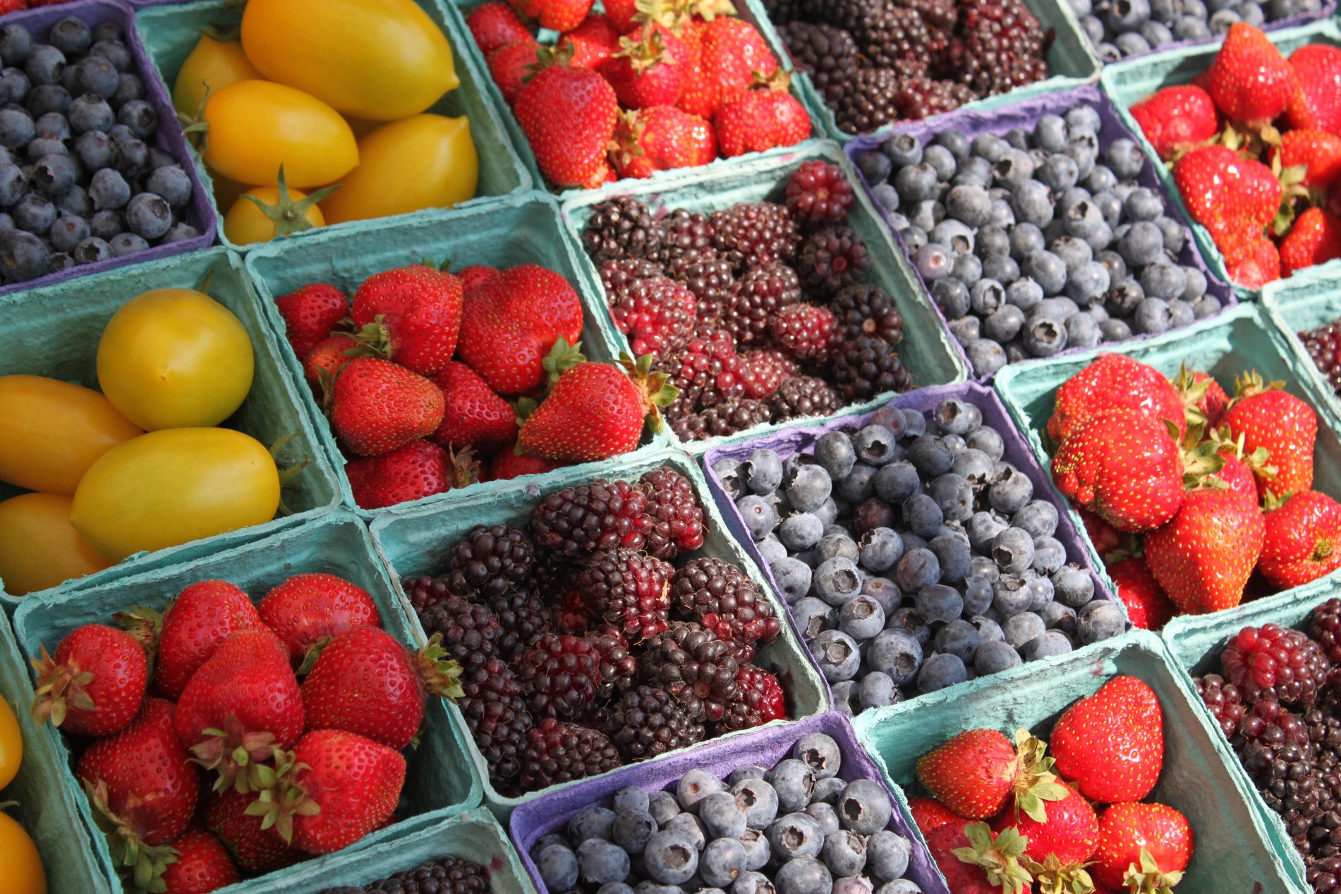 Fresh Berries in Market Stall